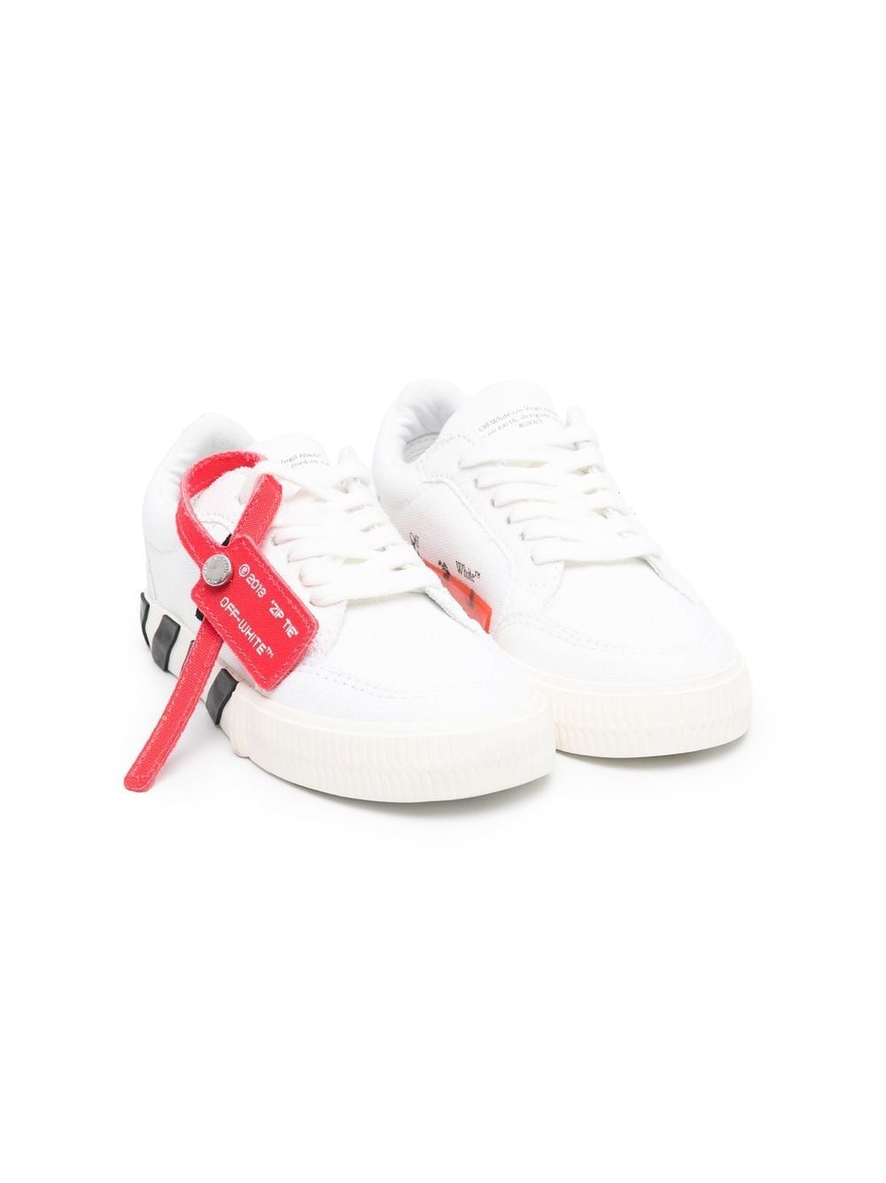White children's shoes with logo
