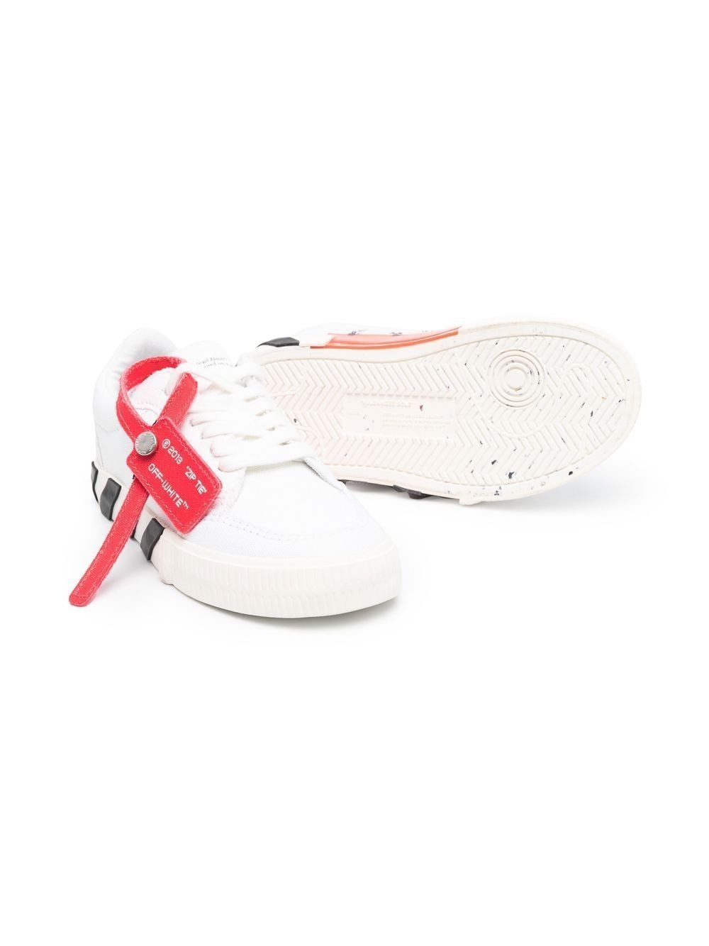 White children's shoes with logo