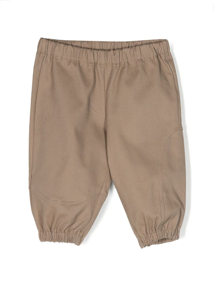Beige trousers for baby girls with logo