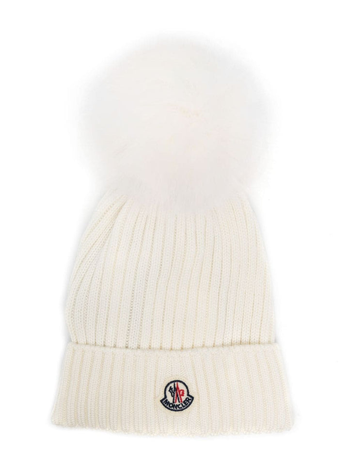 White children's hat with pompom