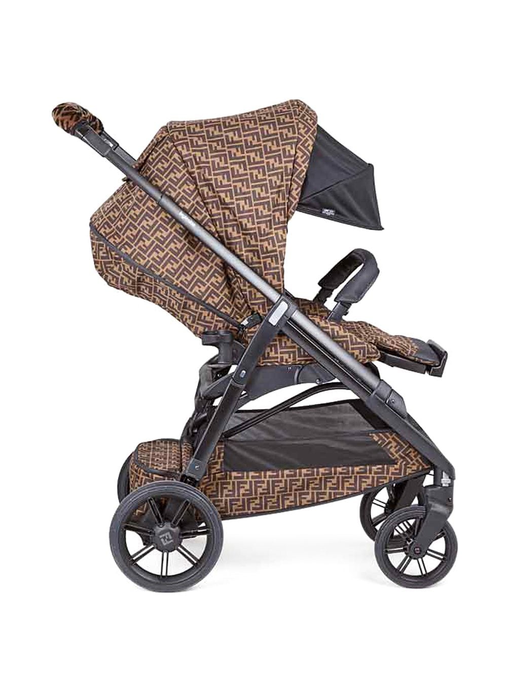 Brown and black baby stroller with logo
