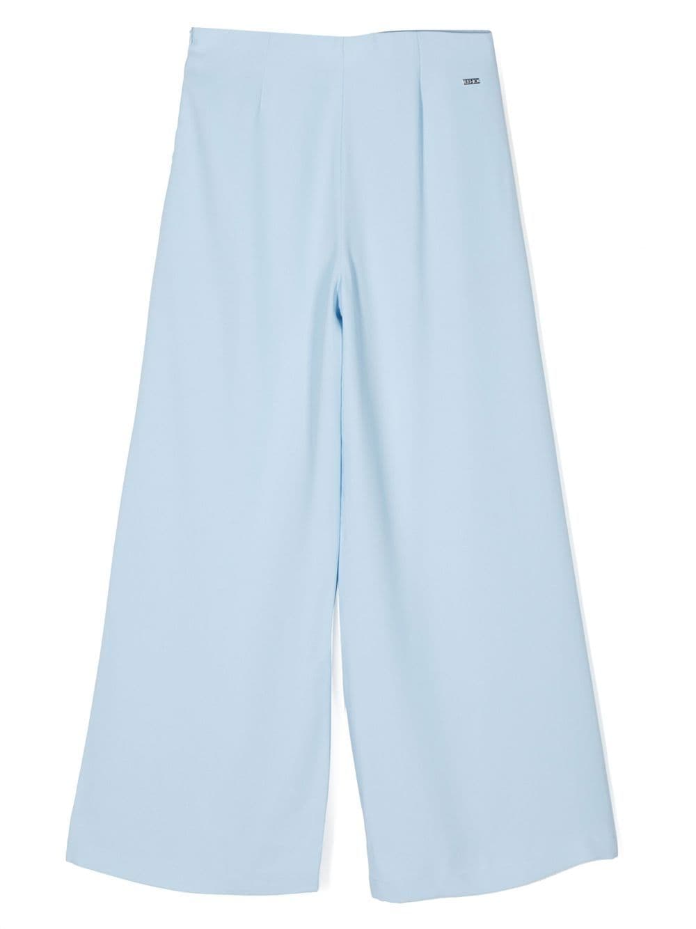 Light blue trousers for girls