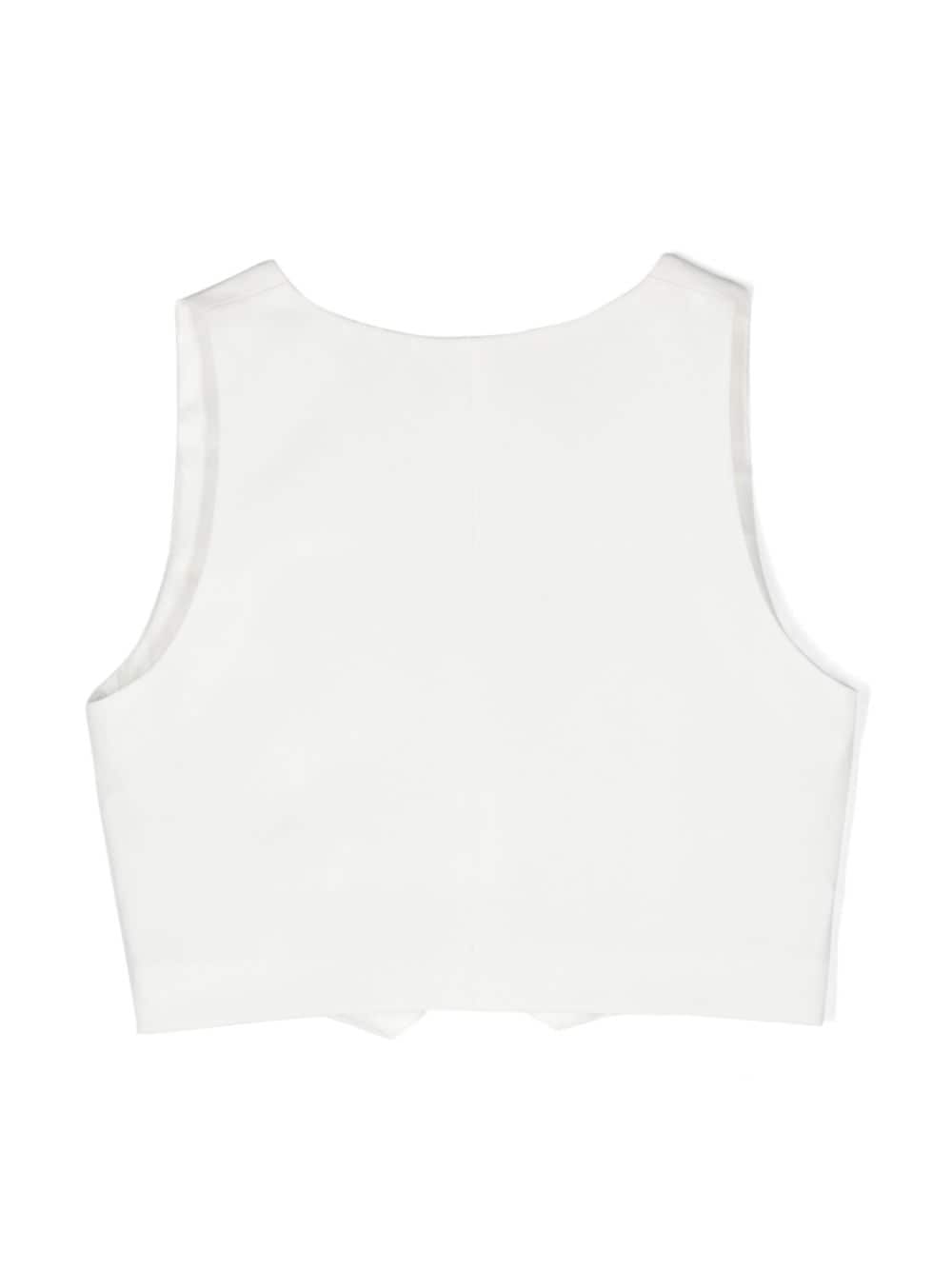 White vest for girls with logo plaque