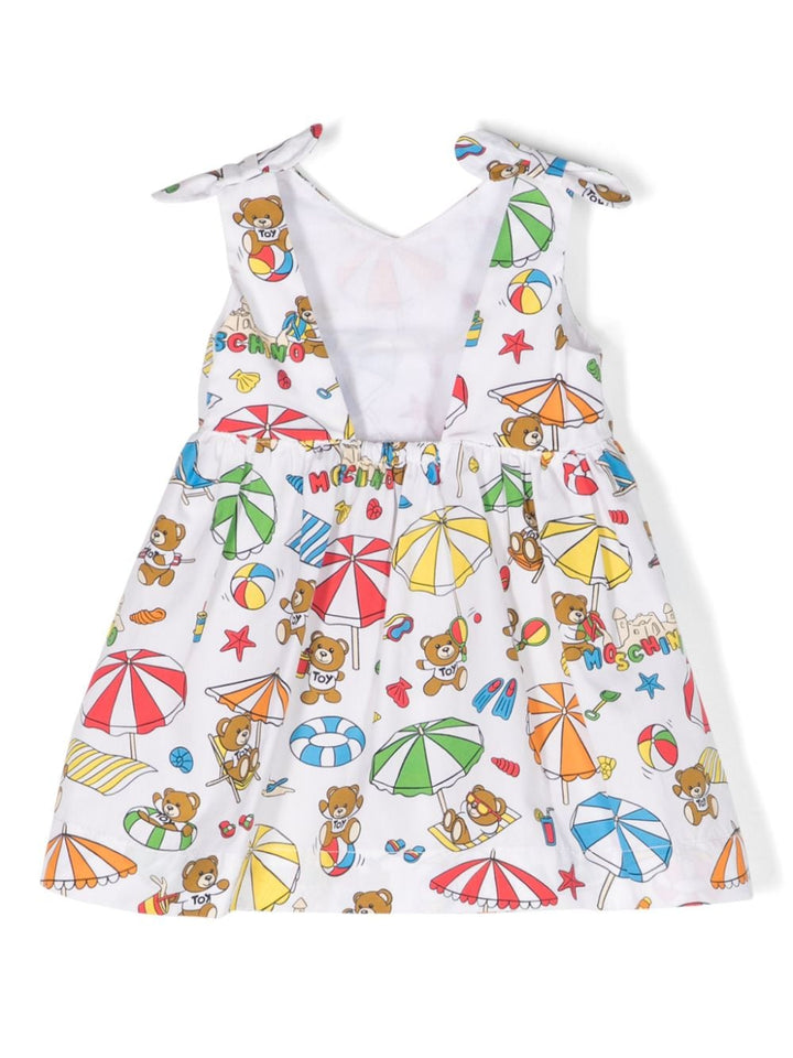 White dress for baby girls with multicolored print