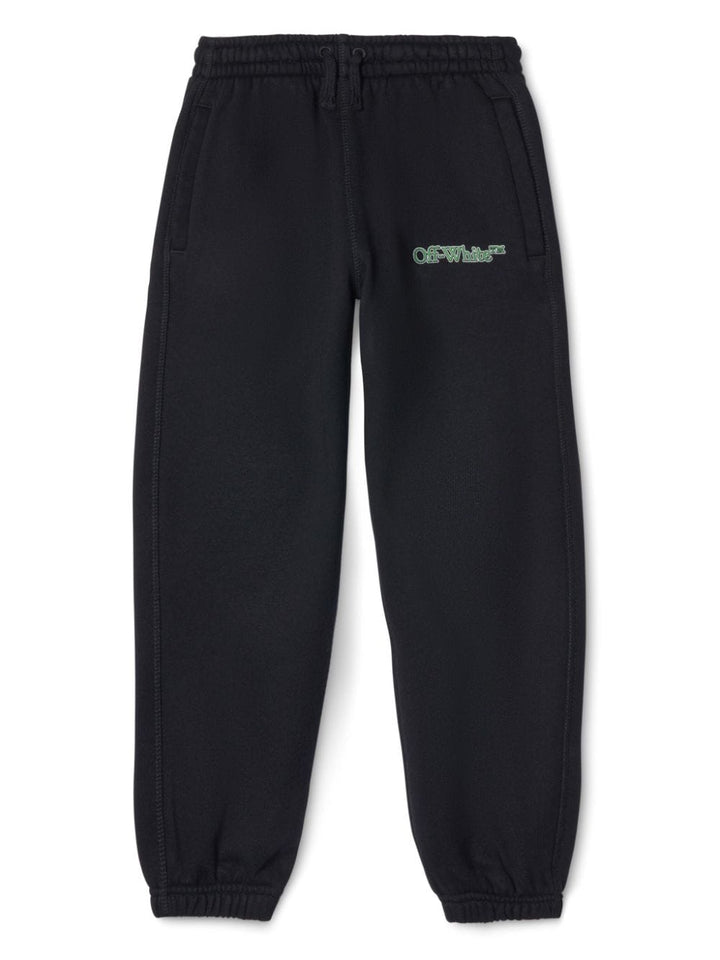 Black sports trousers for children with green logo