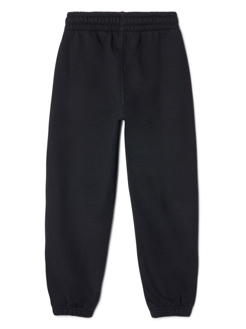 Black sports trousers for children with green logo