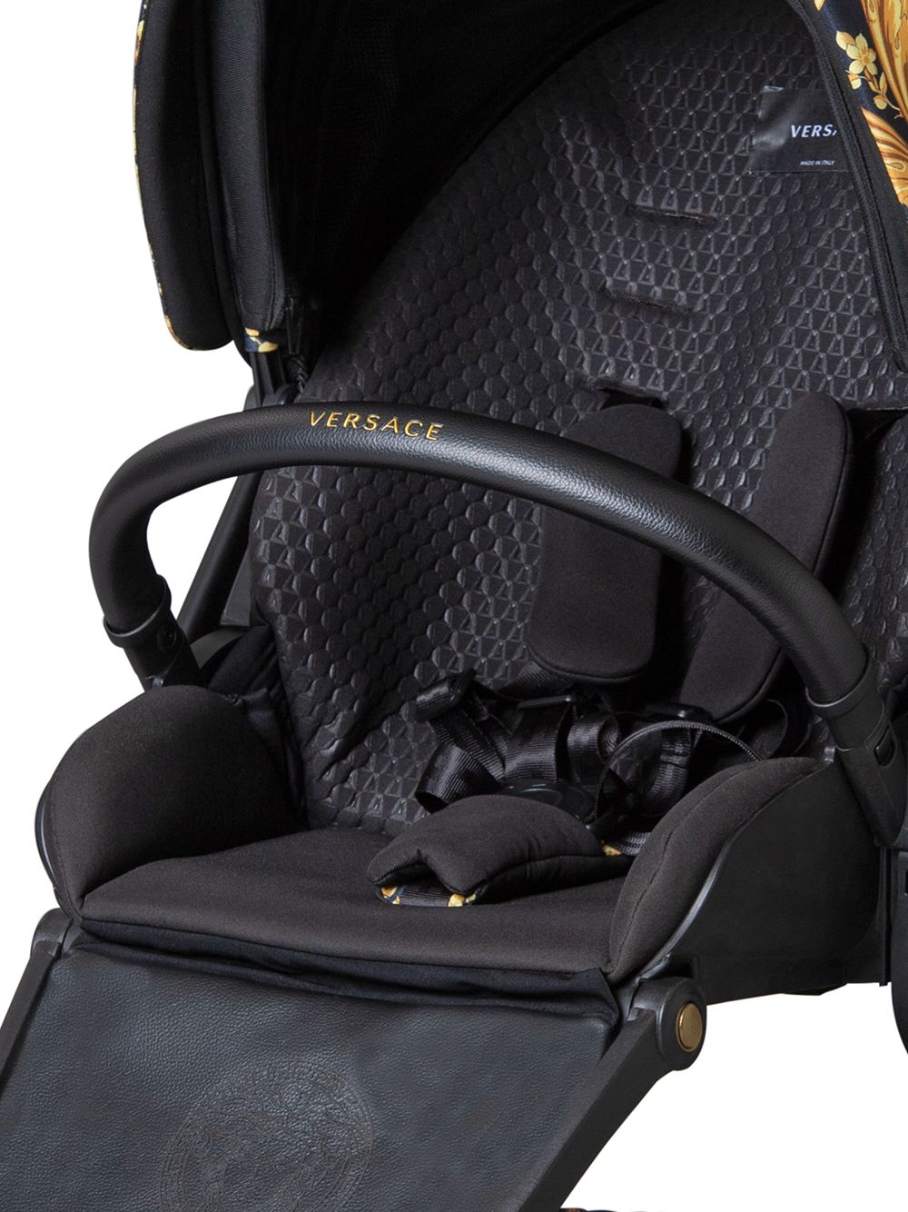 Black and gold stroller for newborns