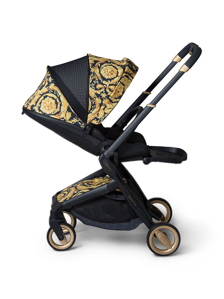 Black and gold stroller for newborns
