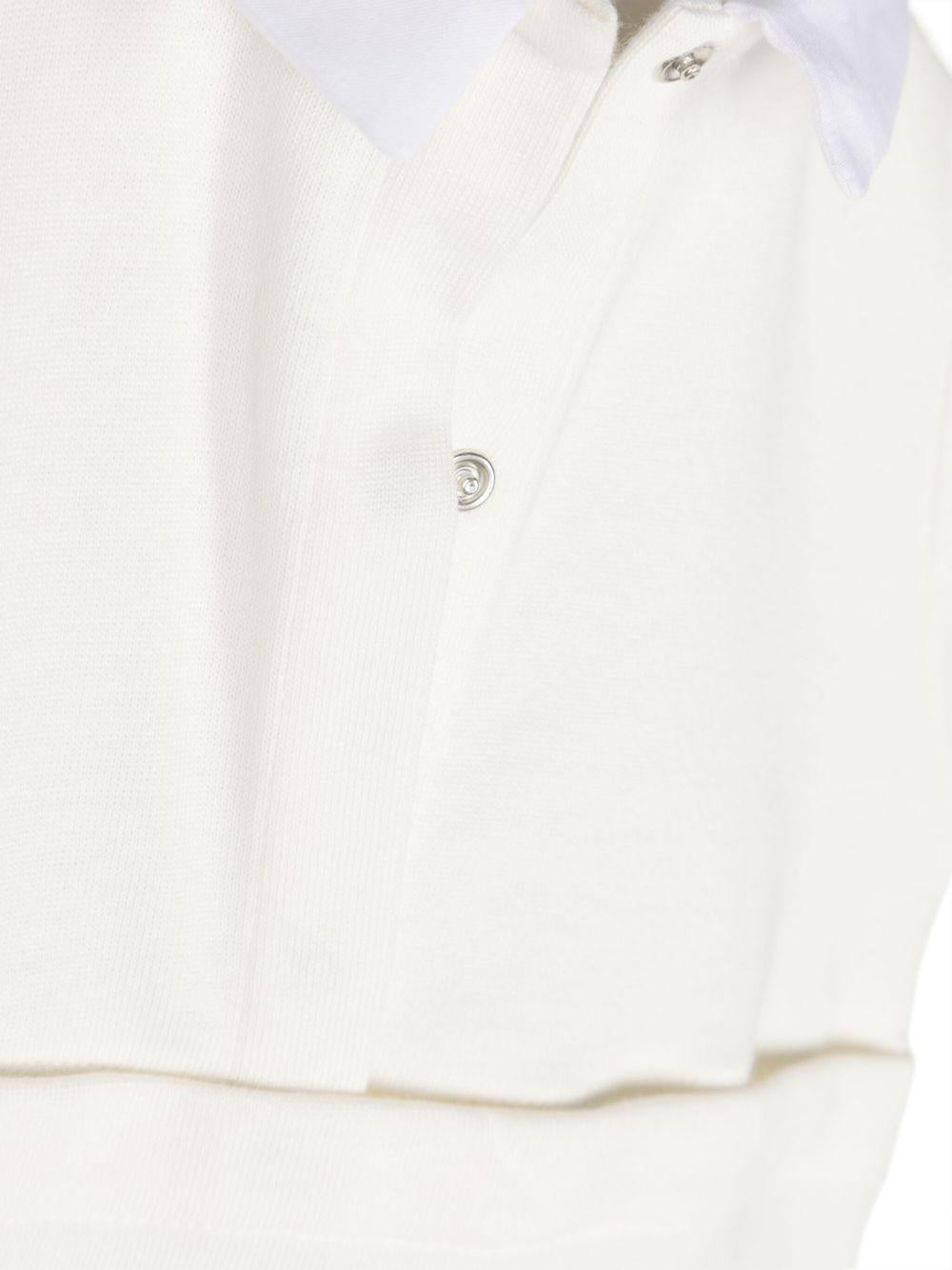 Pagliaccetto bianco per neonato con logo