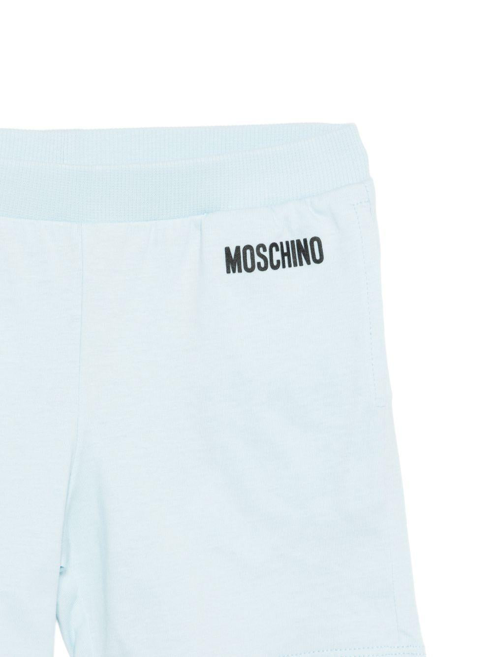 Completo bianco/azzurra per neonato M5G00MLAA01 84325 Moschino Kids 