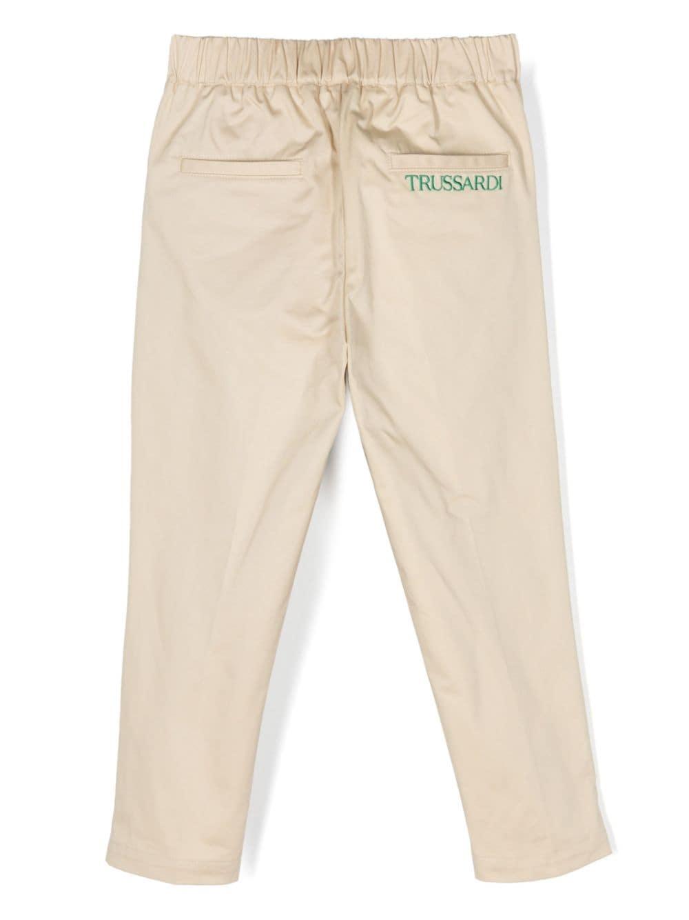 Pantalone beige per bambino con logo verde