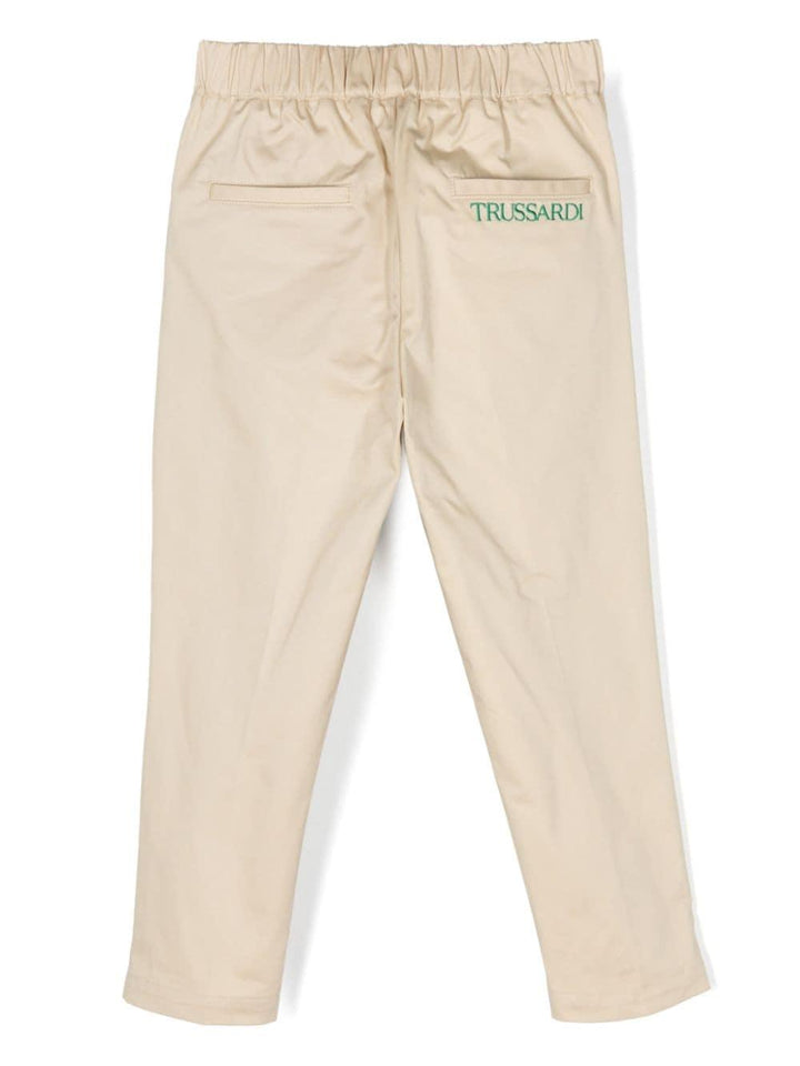 Pantalone beige per bambino con logo verde
