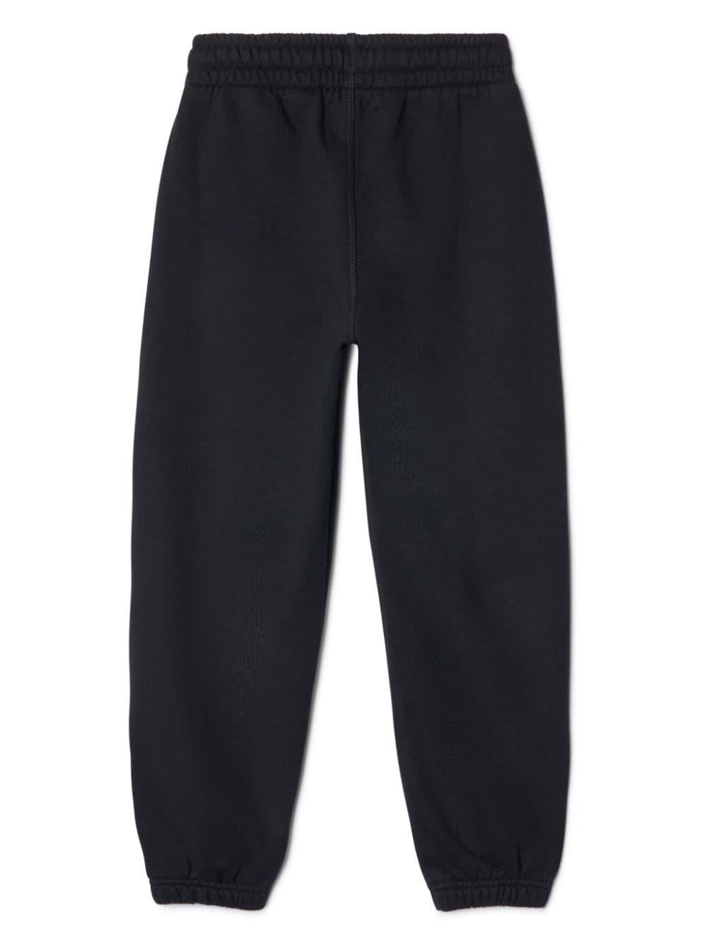 Pantalone sportivo nero per bambino con logo verde