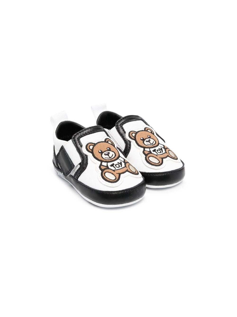 Sneakers bianche e nero per neonati 74266 1 Moschino Kids 