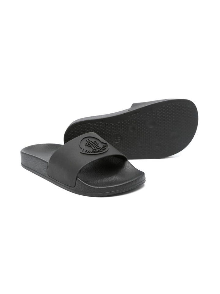 Black children's slippers with logo