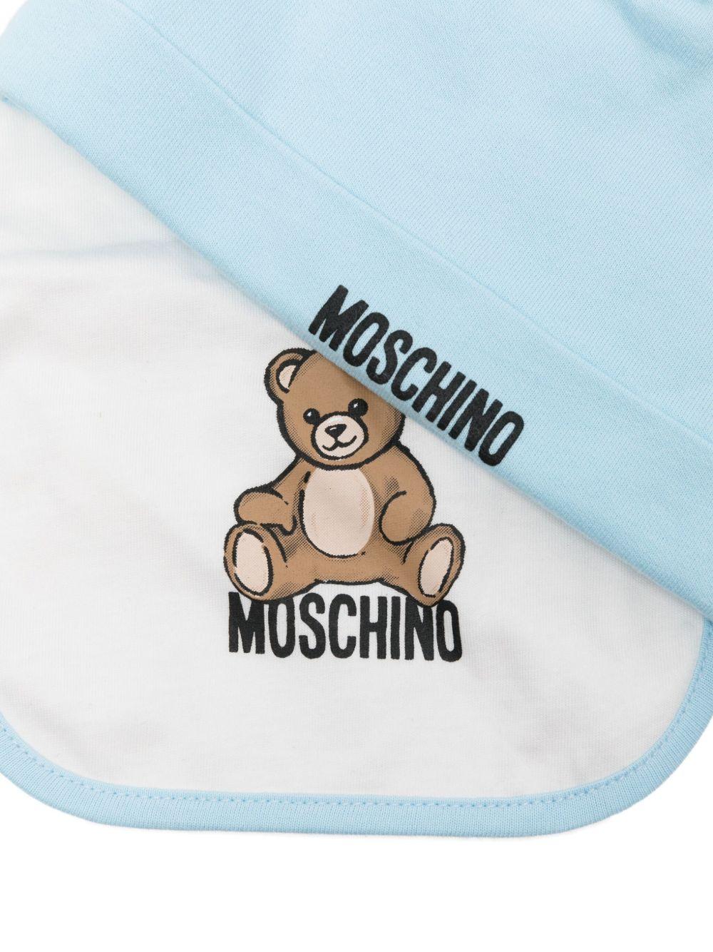 Cappello e bavetta azzurro per neonato MUY08LLCA40 40304 Moschino Kids 