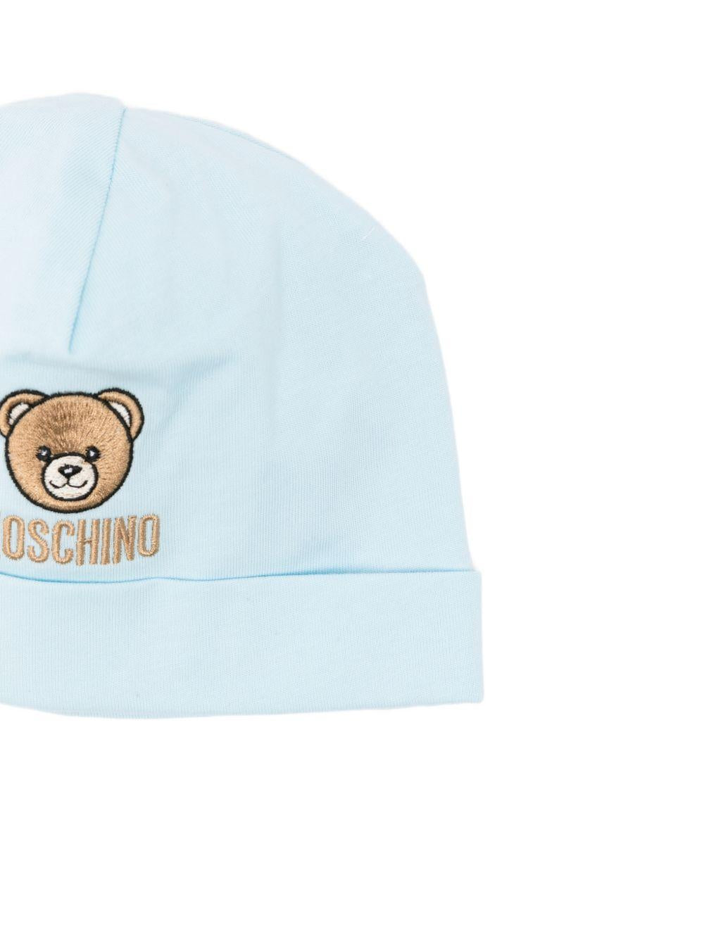Kit cappello bavetta azzurra per neonato MRY03ELAA23 40304 Moschino Kids 