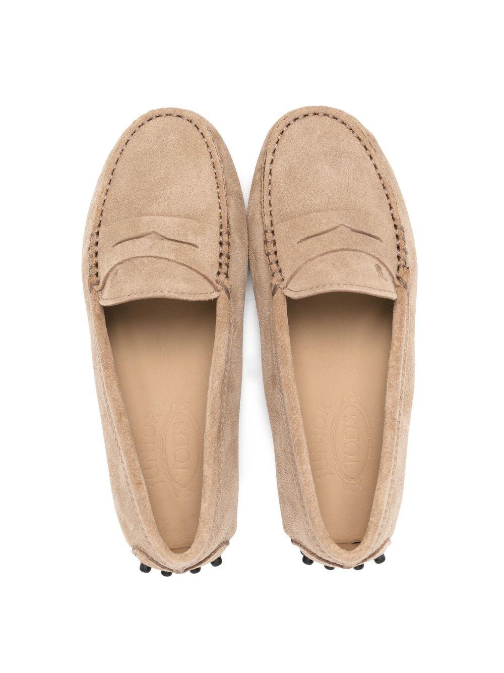 Beige leather moccasins for children