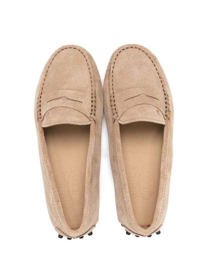 Beige leather moccasins for children