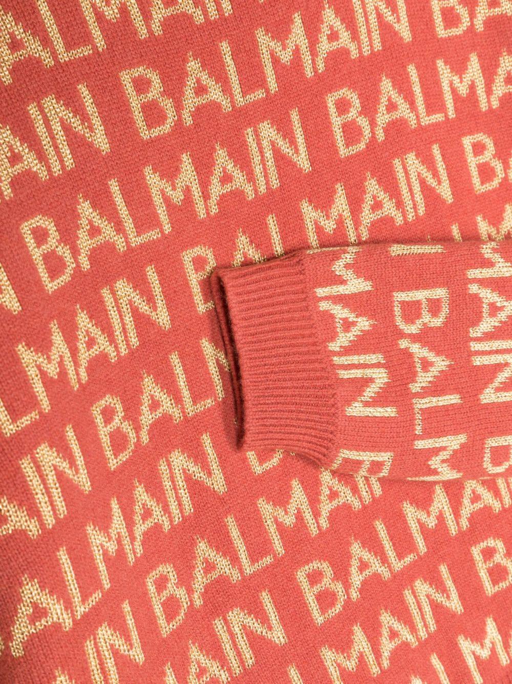 Coral red sweater for girls with gold logo