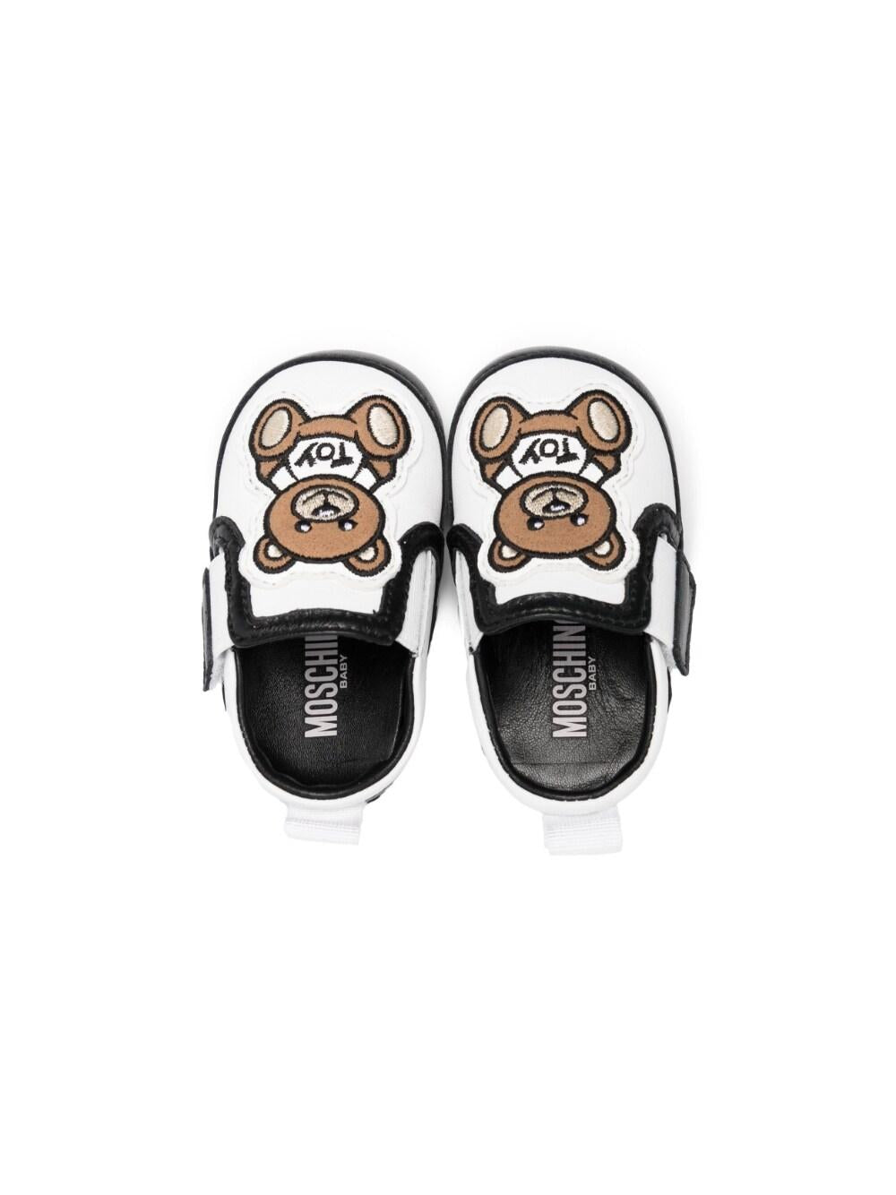 Sneakers bianche e nero per neonati 74266 1 Moschino Kids 