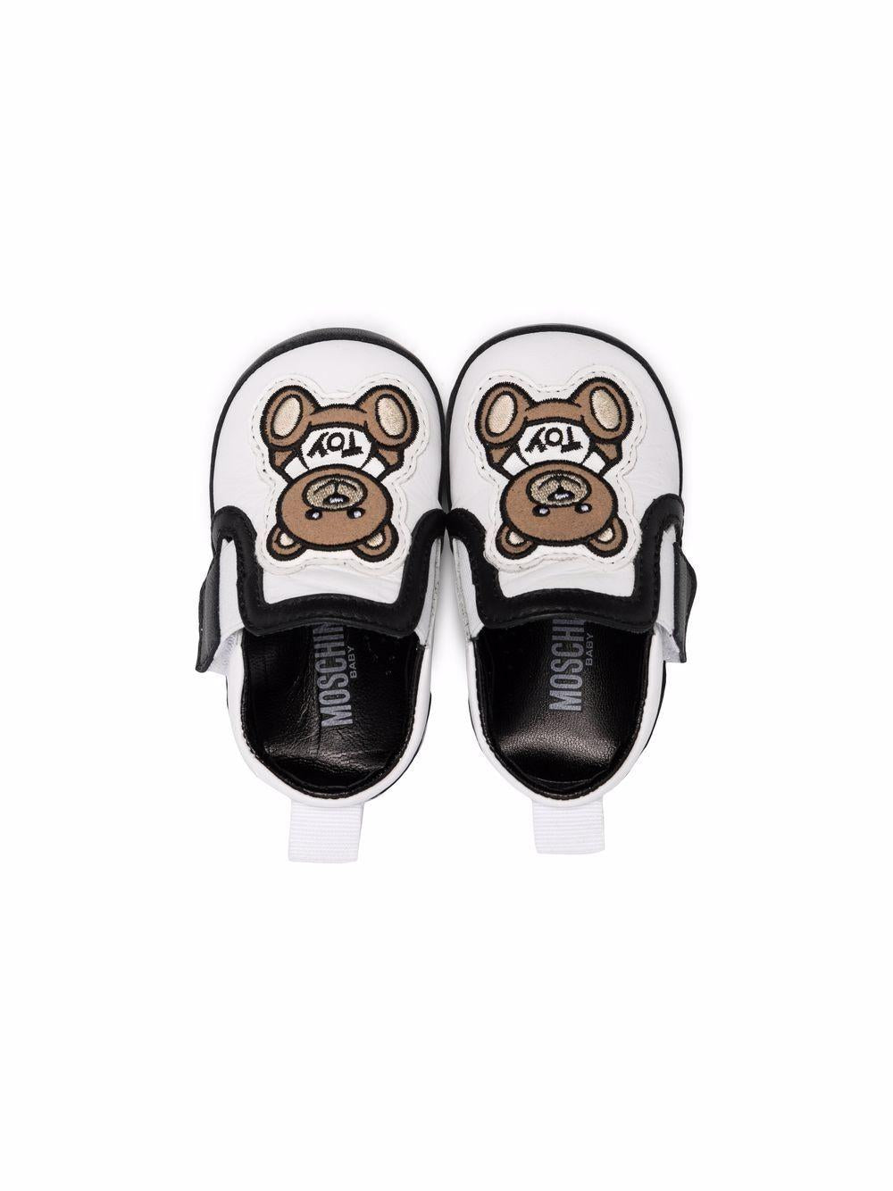 Scarpe per neonato in pelle bianche e nere 70028 1 Moschino Kids 