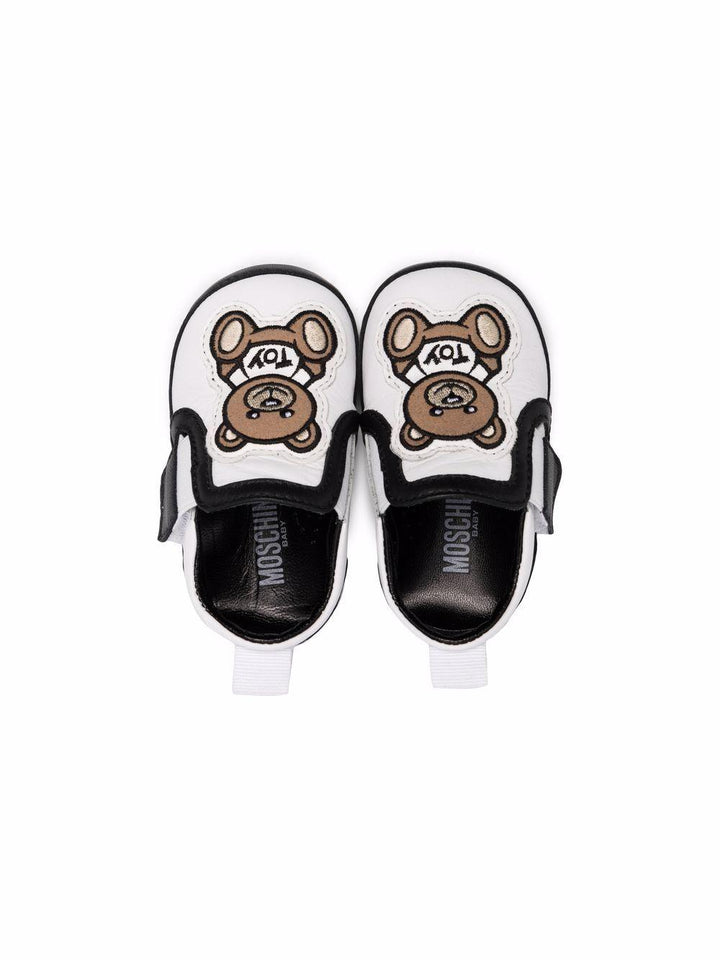 Scarpe per neonato in pelle bianche e nere 70028 1 Moschino Kids 