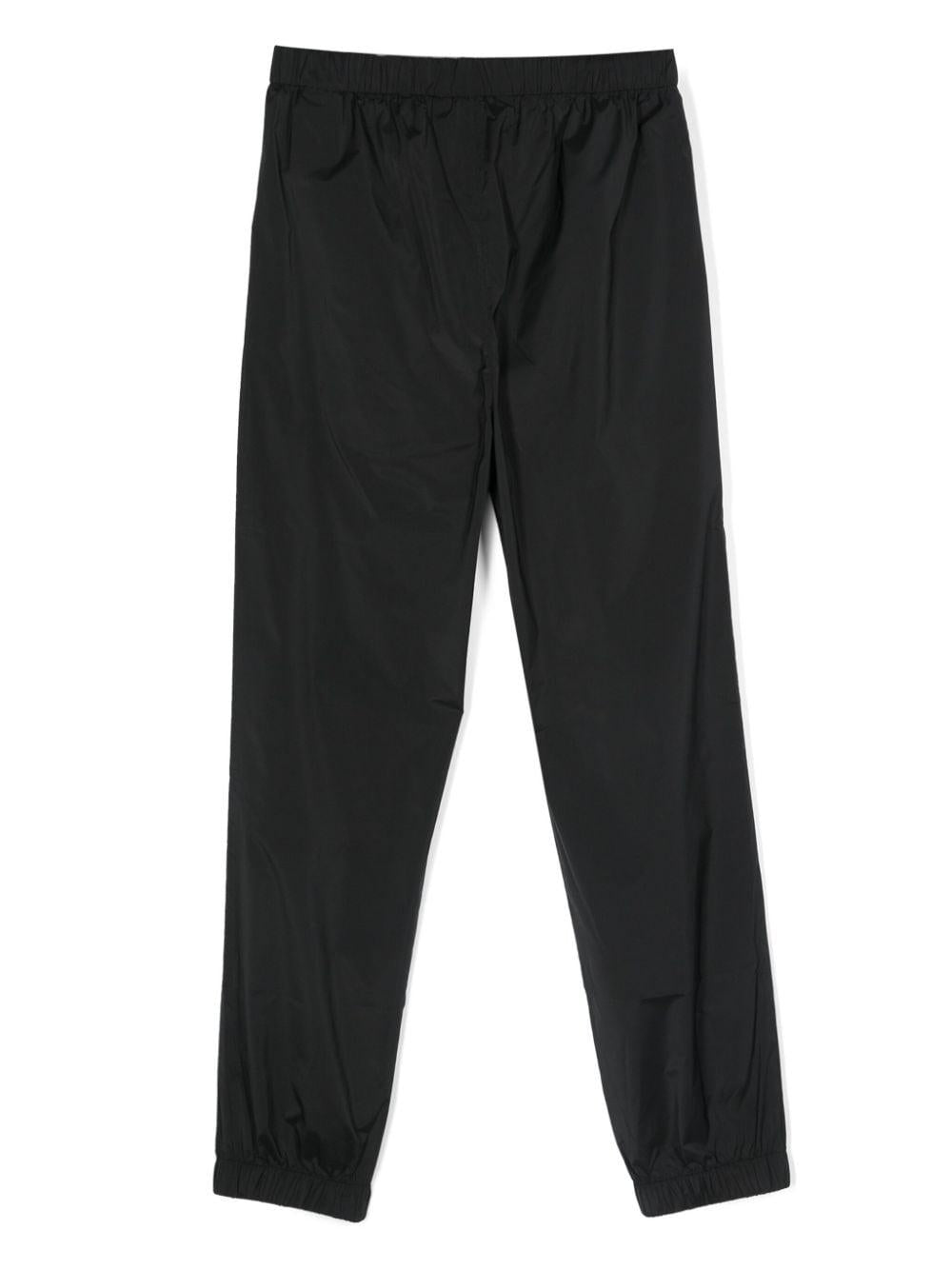 Black trousers for boys with logo