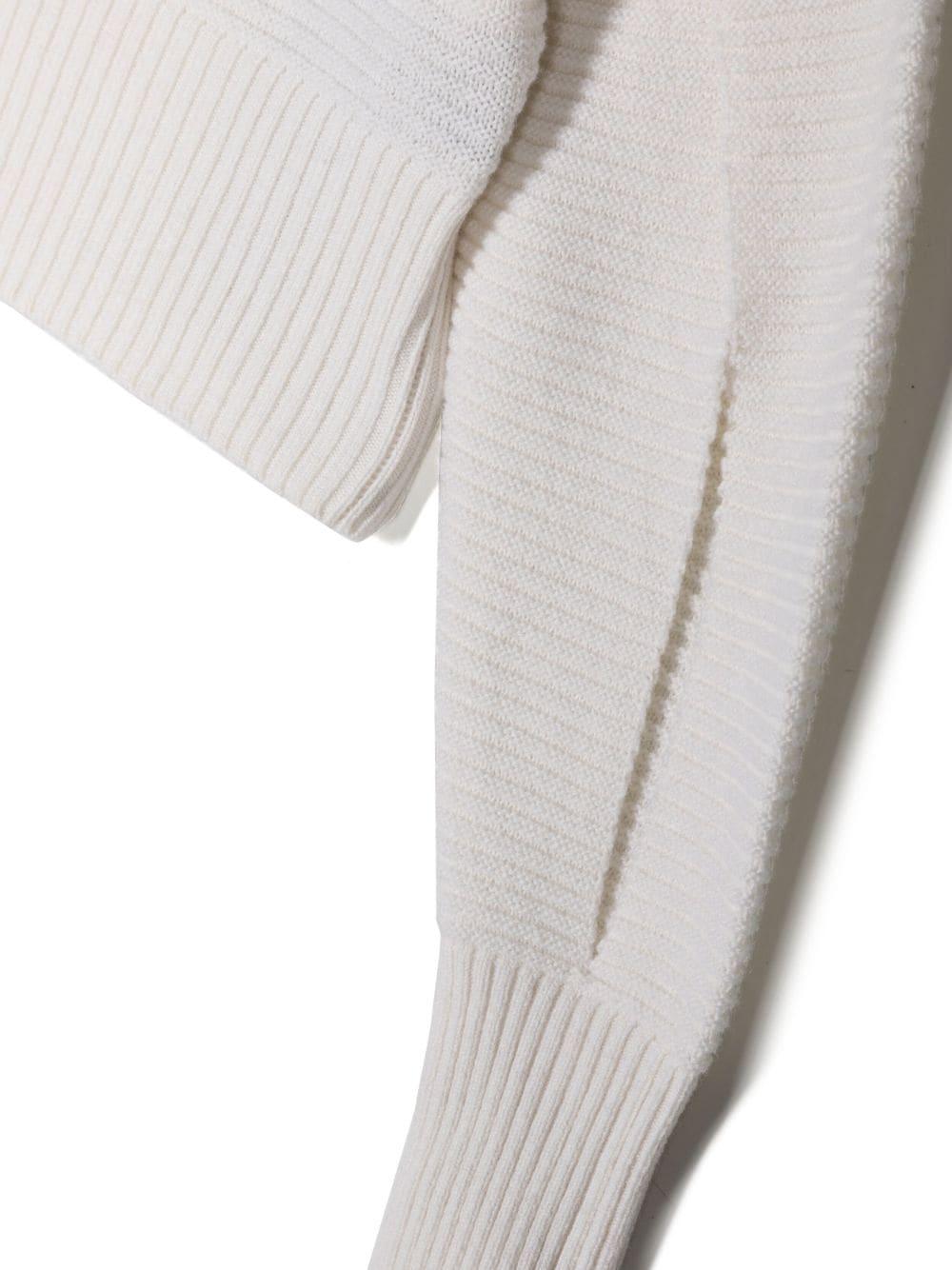 White sweater for girls with gold buttons