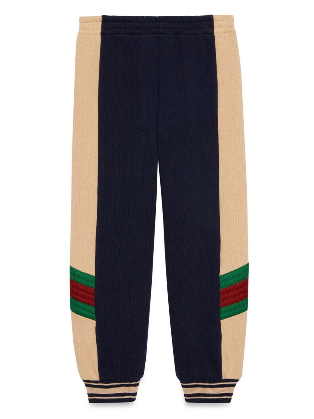 Pantalone sportivo blu e rosa per bambino