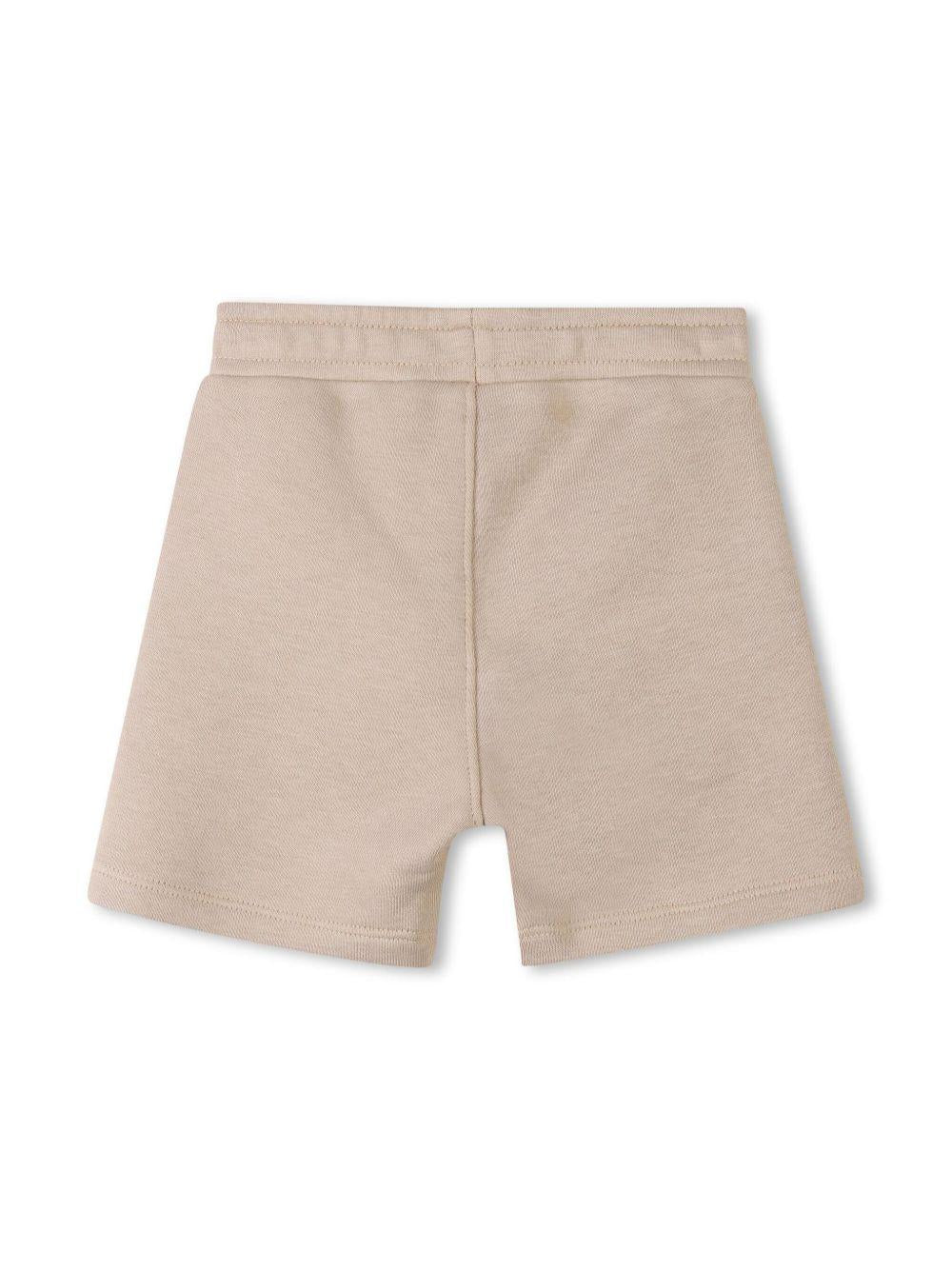 Completo sportivo bianco/beige per neonato