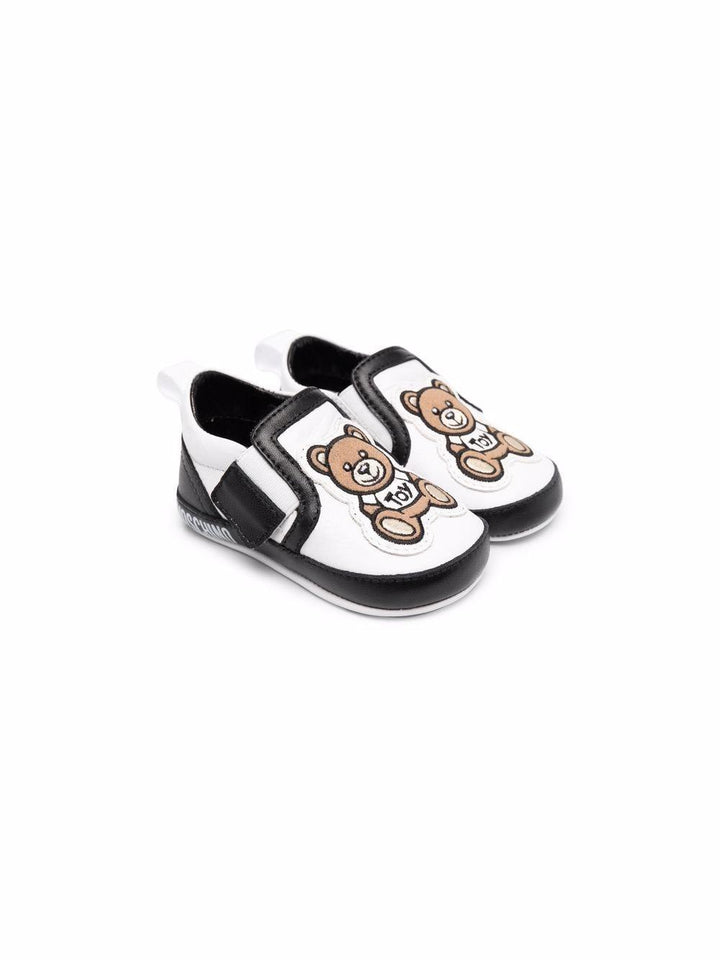 Scarpe per neonato in pelle bianche e nere 70028 1 Moschino Kids 