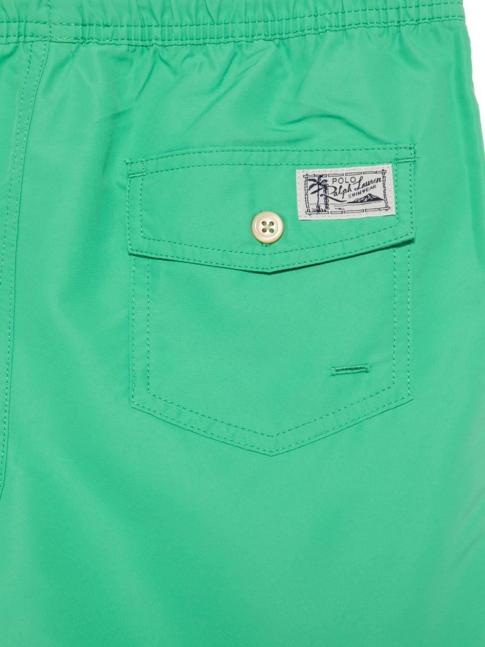 Costume verde brillante per bambino