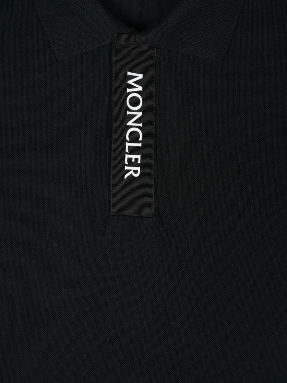 Black polo shirt for boys with logo