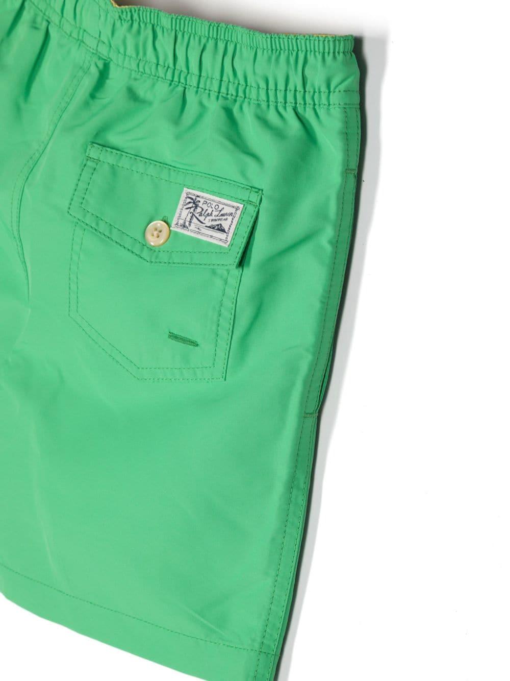 Green swimming shorts for boys