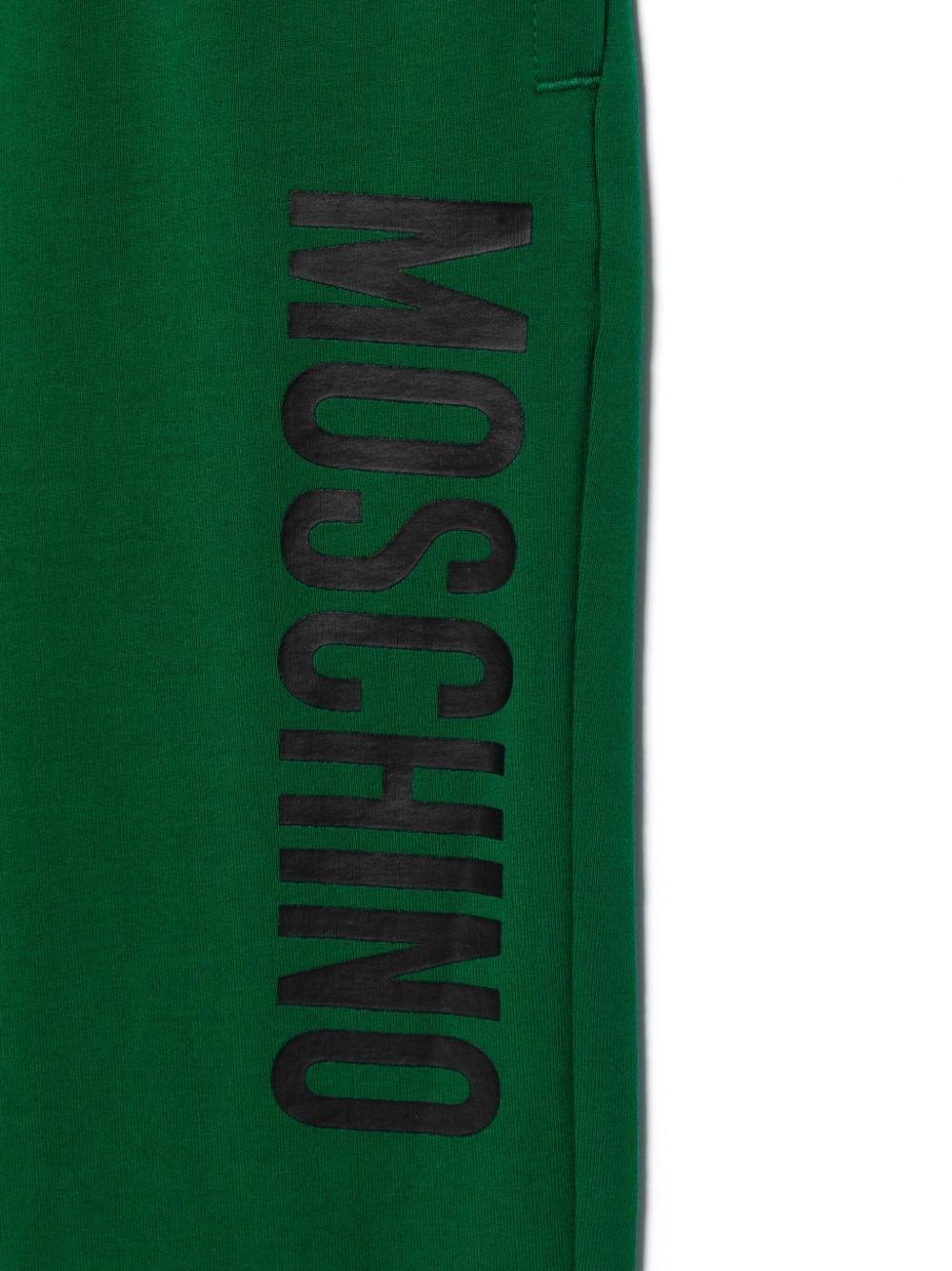 Emerald green trousers for children with logo